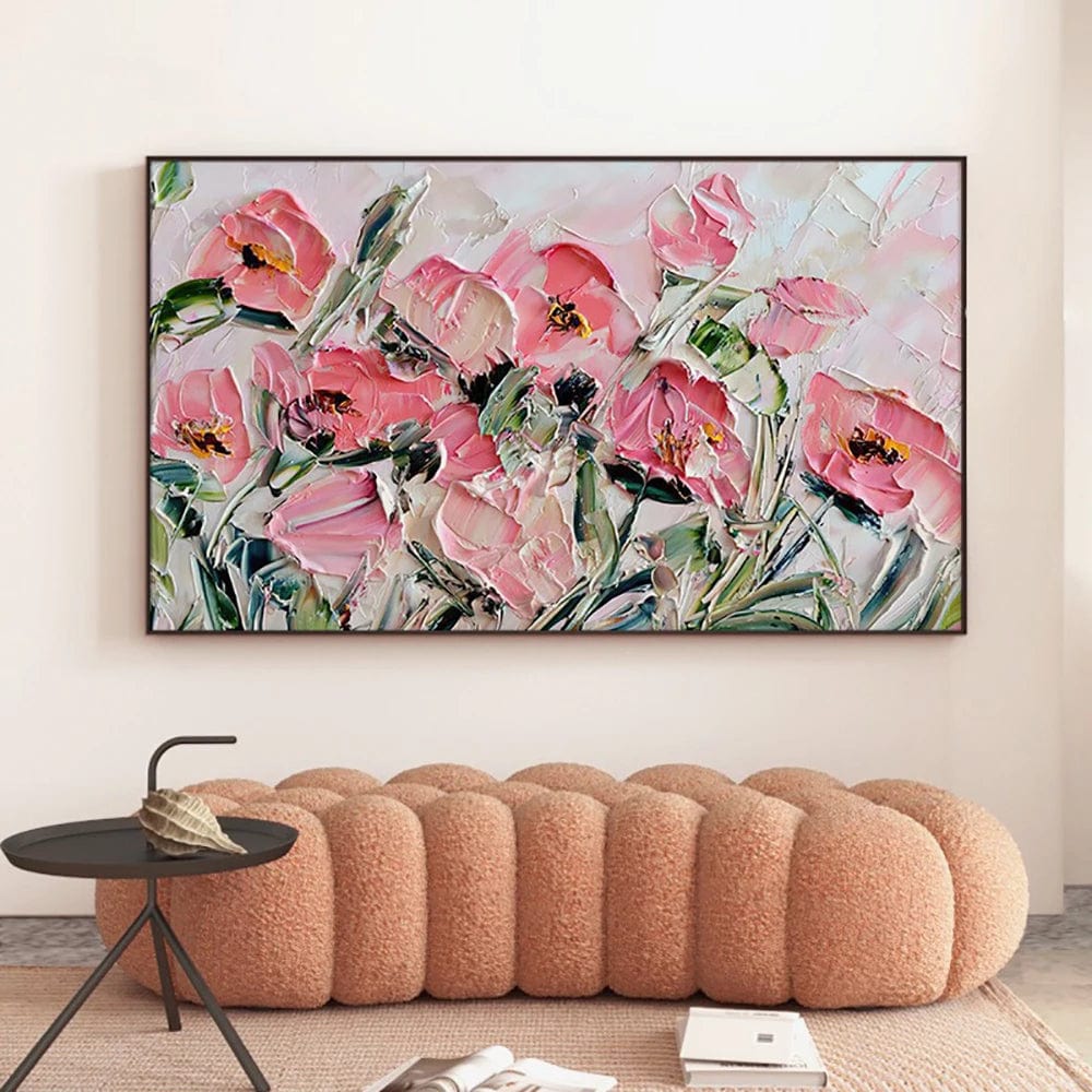 Abstract pink floral landscape wall art, textured pink roses painting in a black frame above a peach bench
