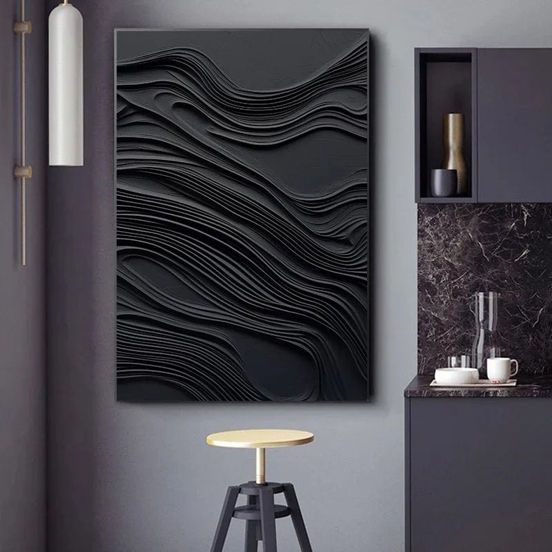 Abstract black waves wall art, dark fluid and textured relief painting hanging in a modern kitchen