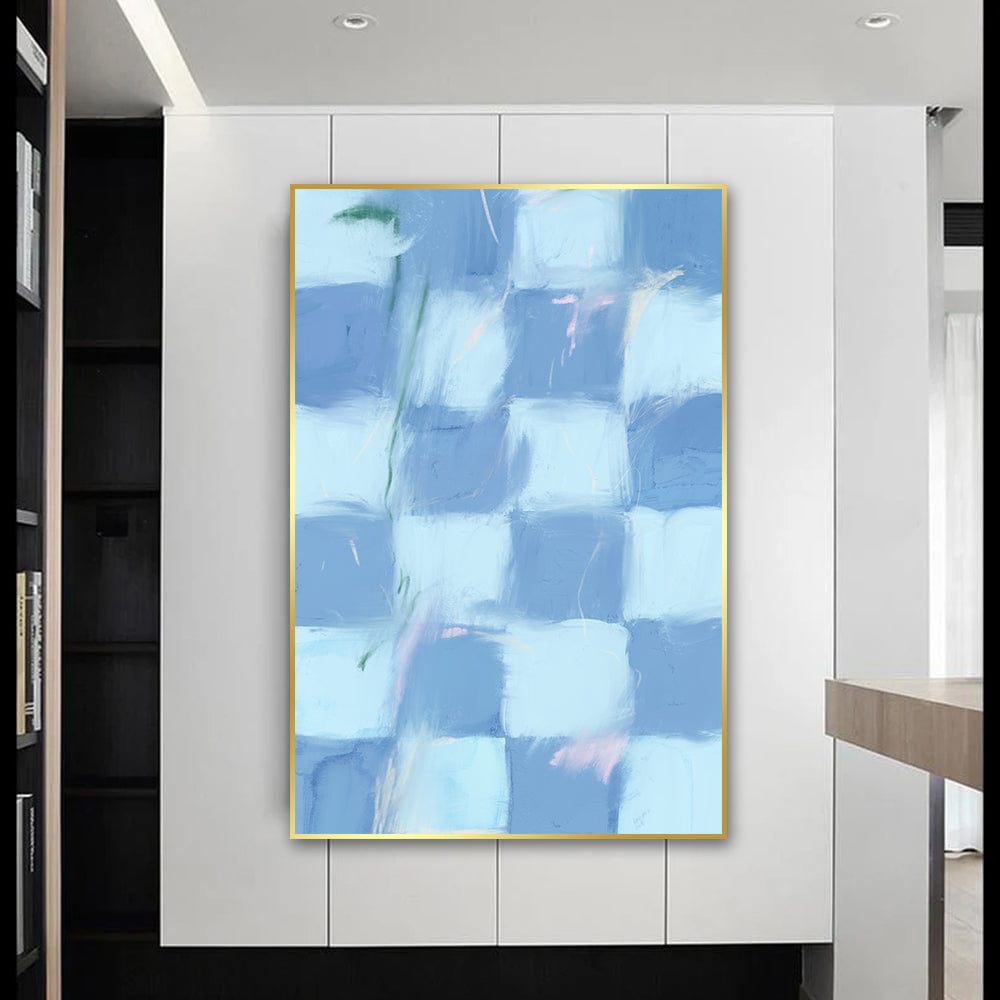 Abstract blue checkered wall art, soft blue and white squares with subtle pink and green strokes in a gold frame