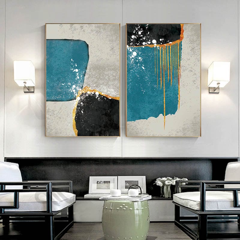 Abstract blue and black landscape wall art, two panels with gold drips hanging above chairs