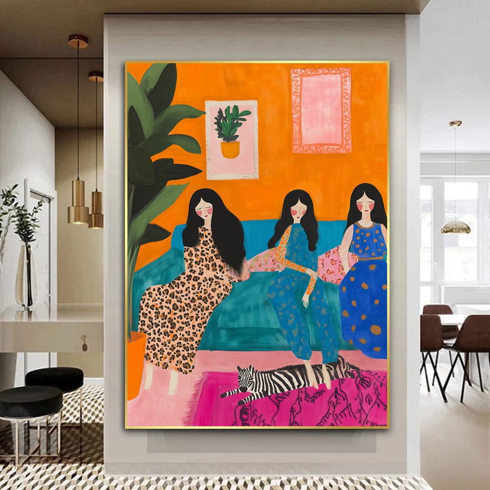 Three women wall art, dark-haired sisters on a teal couch in patterned dresses, orange wall, gold frame in a dining area