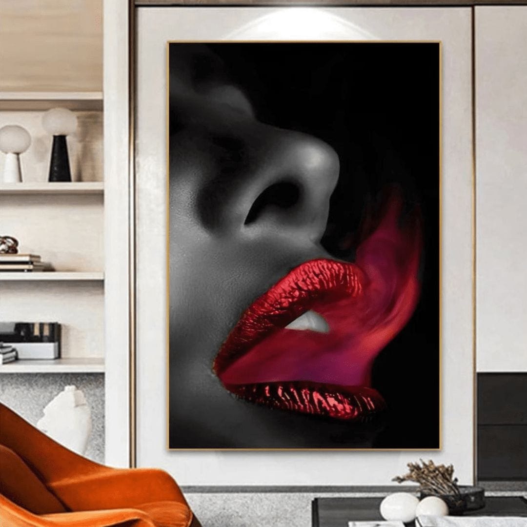 Red lips wall art, close view of a gray female face exhaling red smoke on black, in a thin frame by white shelves
