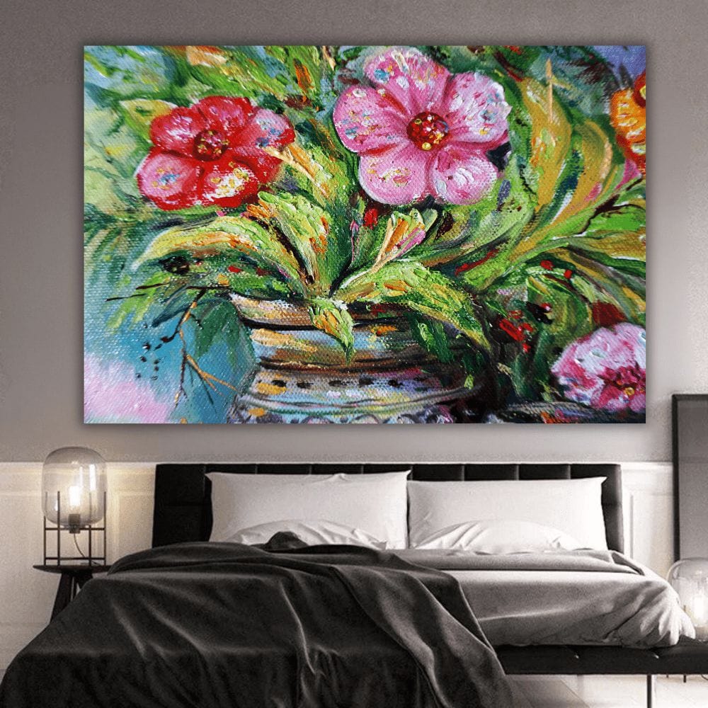 Vibrant floral nature wall art, pink and red blooms in a patterned vase with lush green foliage above a bed