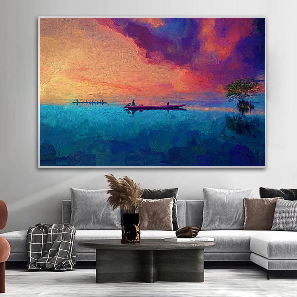 Blue and orange sunset landscape wall art, boats on tranquil water under warm skies above a modern sofa