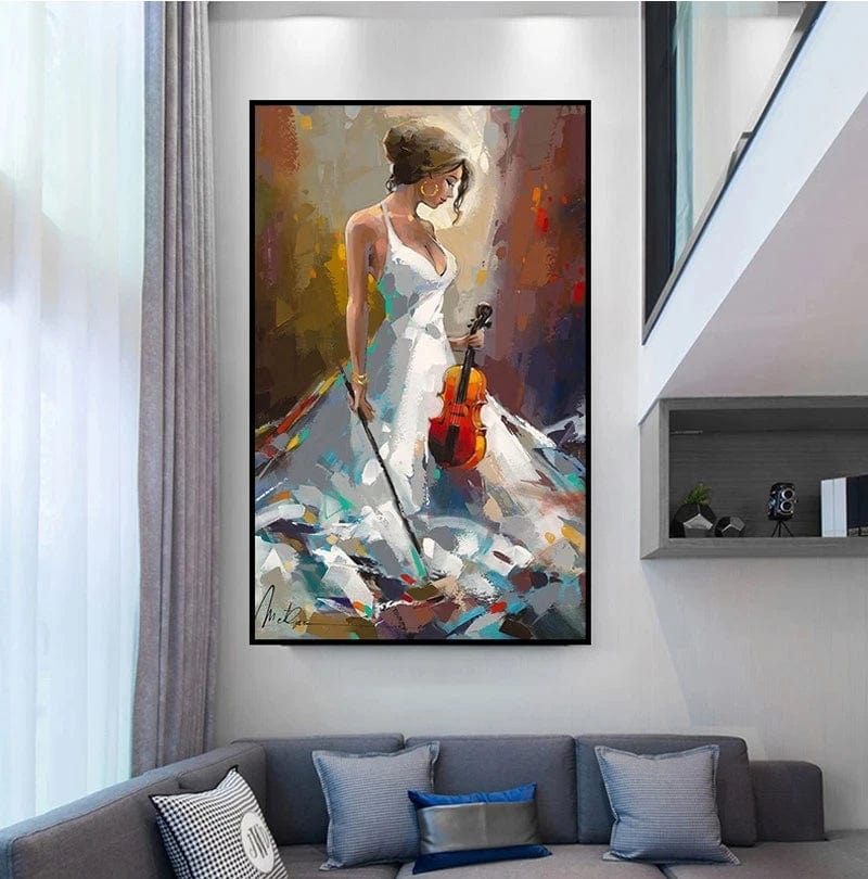 Black framed woman with violin wall art hanging above a gray sofa in a modern living room