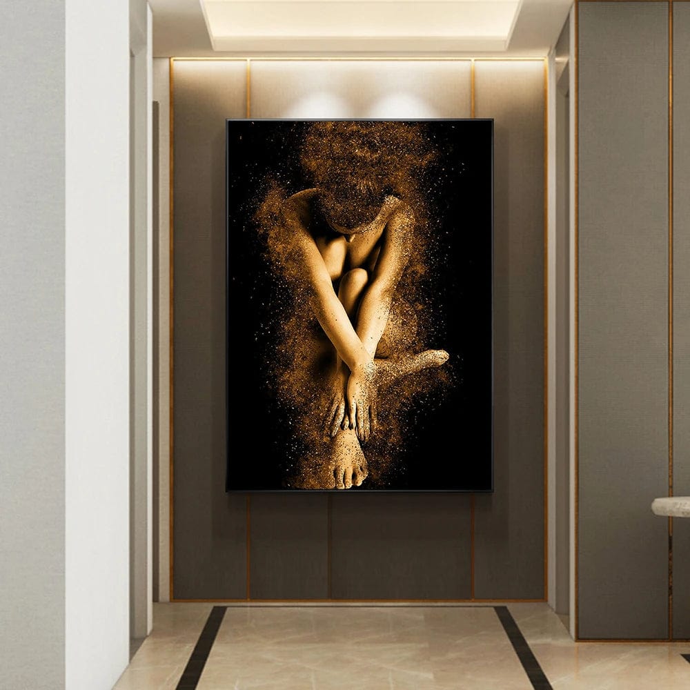 Black and gold woman portrait wall art, seated female figure formed from shimmering gold dust particles on a black background