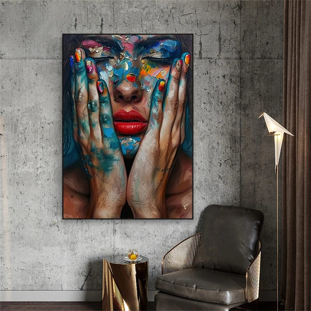 Colorful woman portrait wall art, female face with closed eyes, red lips and paint covered hands, black frame in a lounge