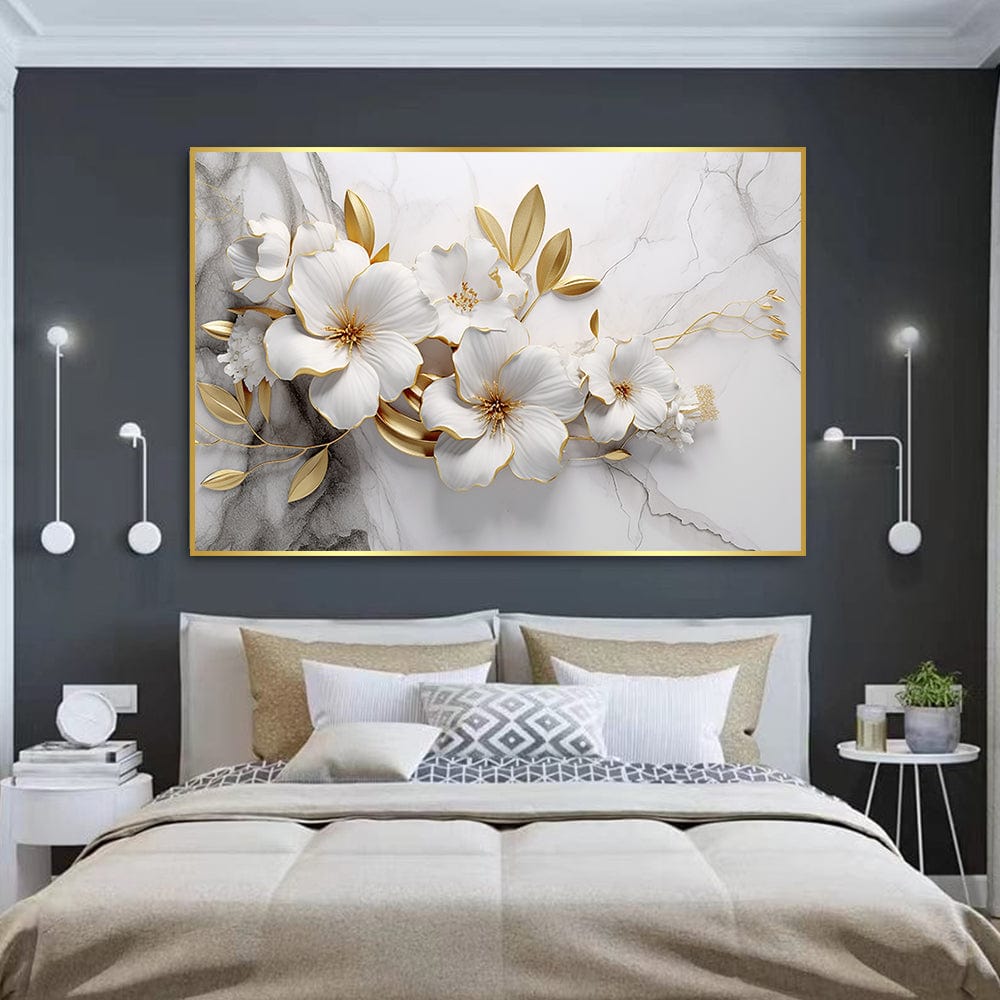 White and gold floral landscape wall art, white blossoms and golden leaves on a grey marble background above a bed