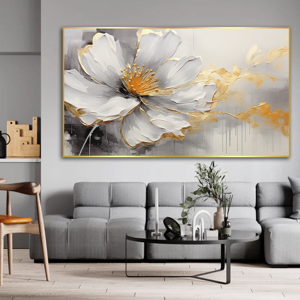 White floral wall art, large blooming flower painting with gold foil accents above a gray sofa in a living room