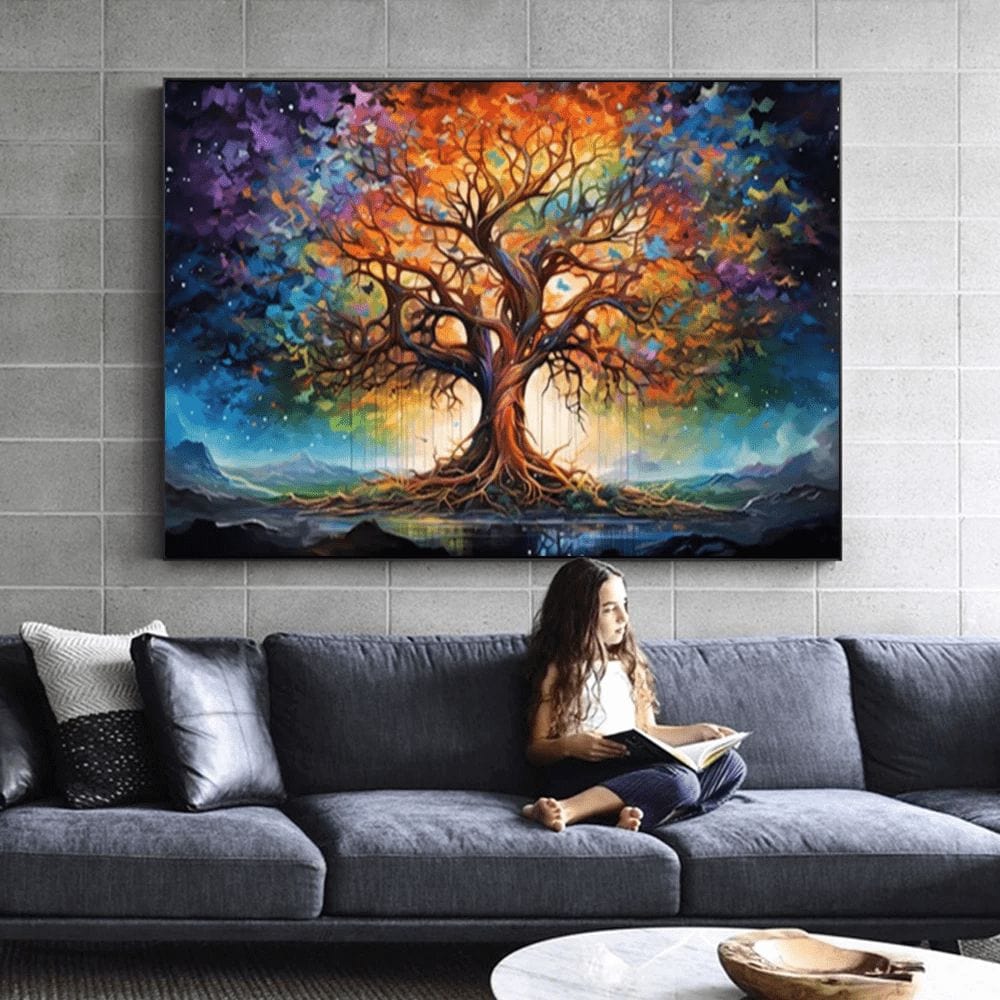 Girl reading on a sofa below a colorful tree landscape wall art print with orange and violet hues