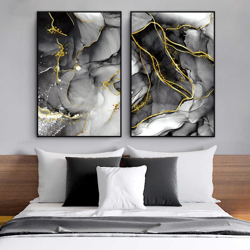 Abstract black and grey ink wall art with gold veins, diptych set hanging above a bed