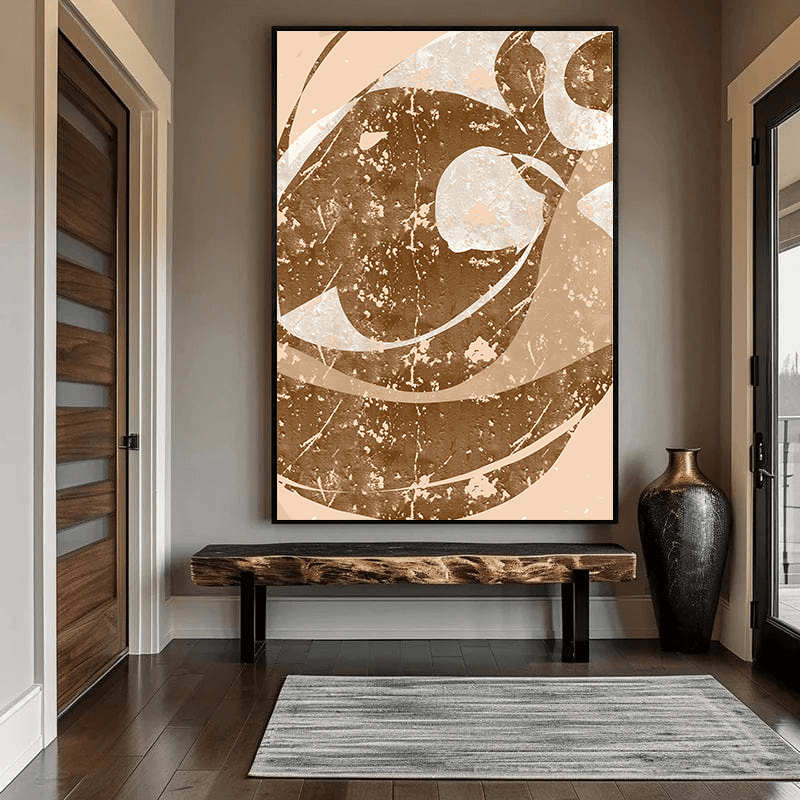 Brown abstract clash wall art, layered earthy brown and cream curved shapes with weathered textures in a black frame