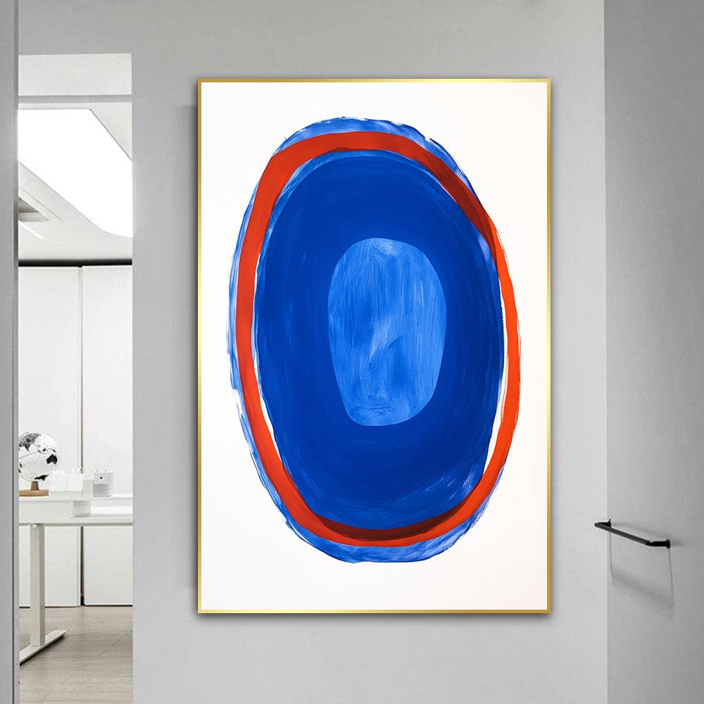 Abstract blue and red oval wall art, thick red border surrounding a tranquil blue center in a thin frame on a white wall
