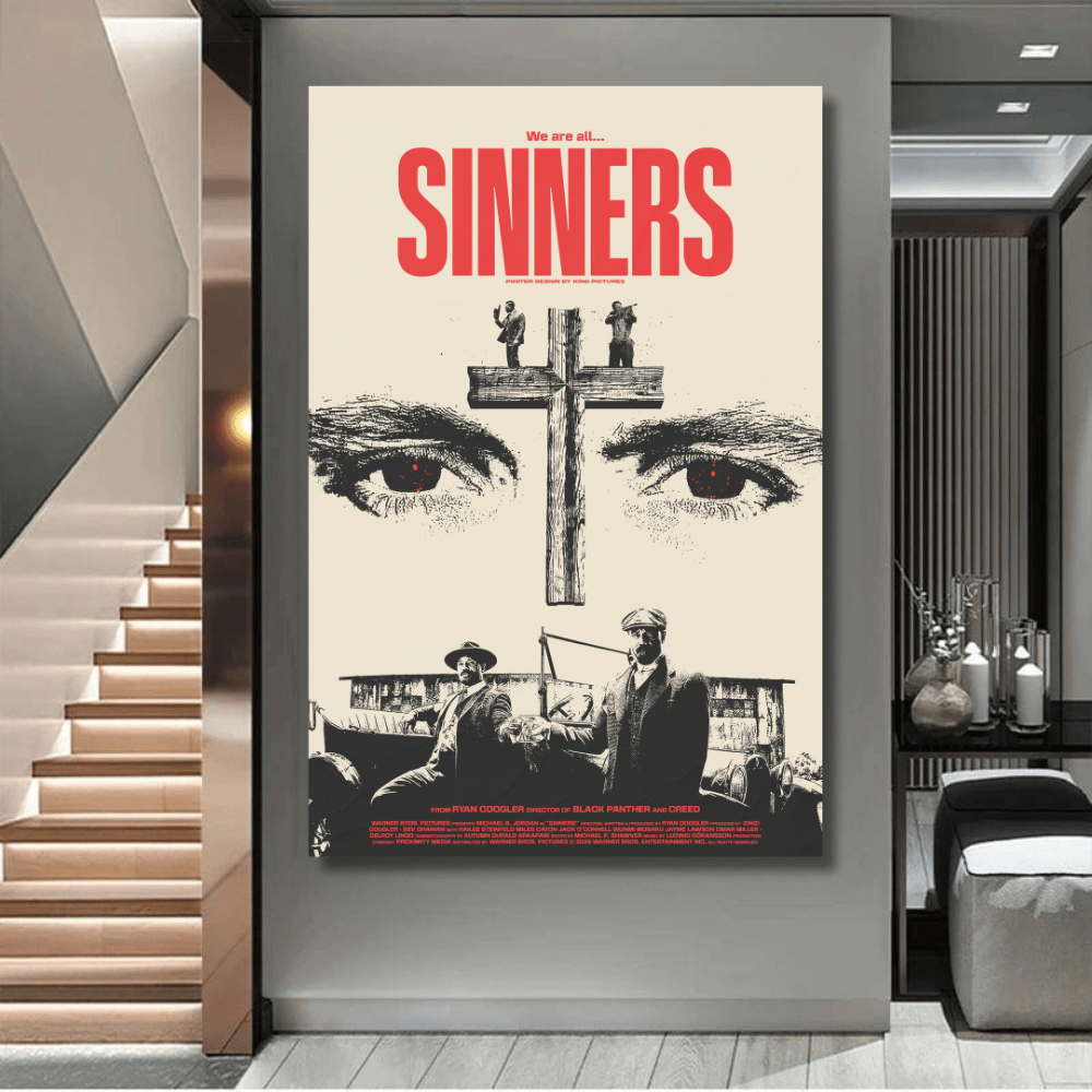 Monochromatic typography and religious portrait wall art with a central wooden cross and crimson red accents