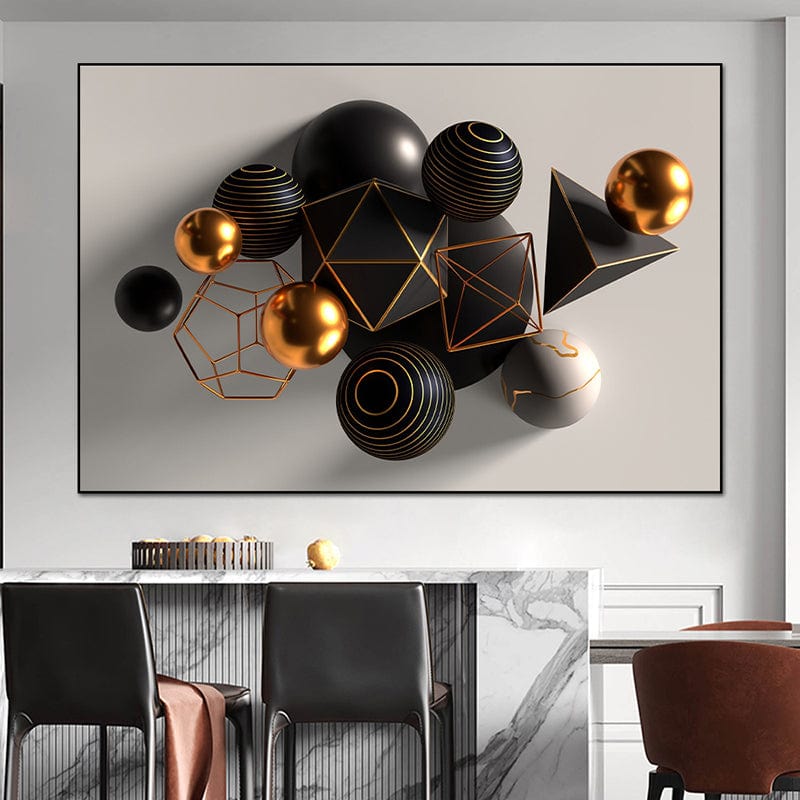 Abstract black and gold geometric wall art, 3D spheres and shapes in a black frame above a kitchen counter