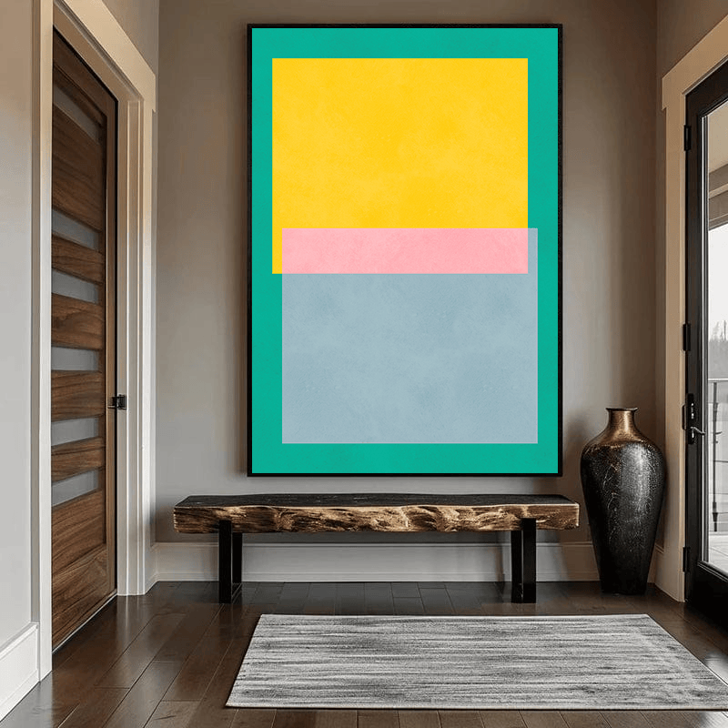 Abstract color blocks wall art, minimal geometric painting in a black frame hanging in an entryway above a rustic bench