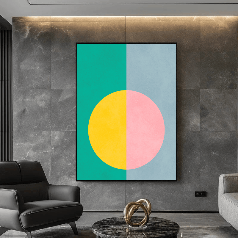 Abstract split circle wall art, geometric teal and blue background with yellow and pink circle in a black frame