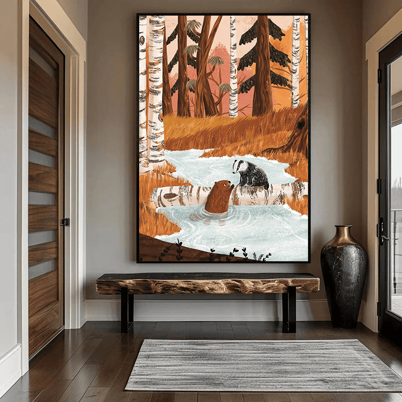 Woodland stream wall art with a beaver and badger, earthy tones in a black frame hanging above a bench in an entryway