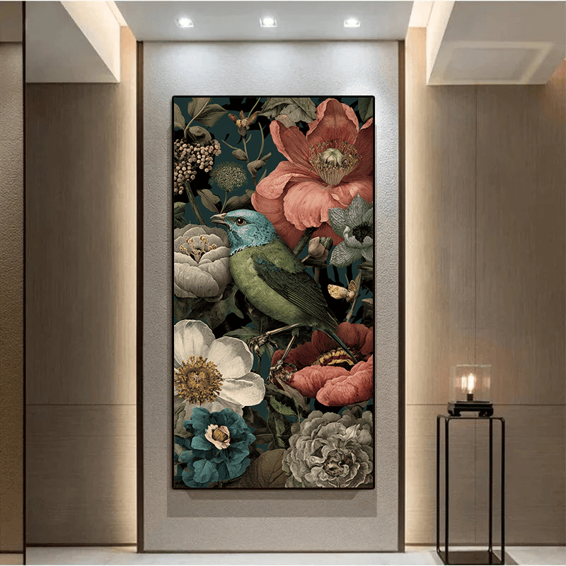 Botanical finch and floral wall art painting, blue bird with blush and ivory flowers in a black frame on a hallway wall