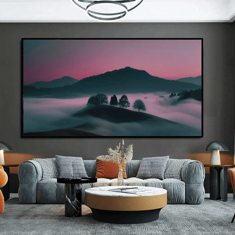 Mountain landscape wall art, pink sunset sky over a dark hill and foggy valley with silhouetted trees in a black frame