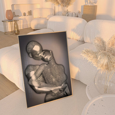 Decorative wall art of a wire mesh sculpture of a woman lying on a white surface.