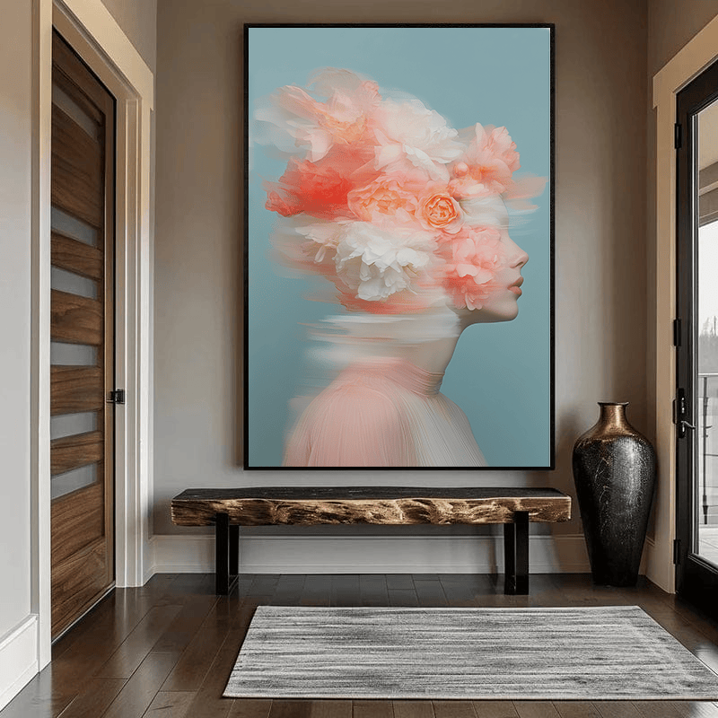 Ethereal floral woman portrait wall art, side profile with pink and white flowers on a blue background in an entryway