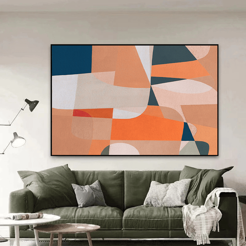 Abstract geometric shapes wall art, orange and blue curved silhouettes and angular forms in a black frame above a sofa