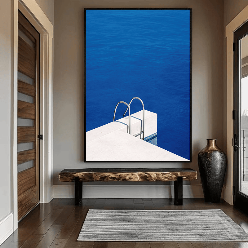 Blue ocean landscape painting, minimalist swimming pool edge and stainless steel ladder with deep blue water wall art