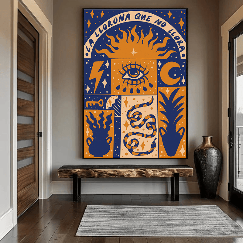 Folk inspired blue and orange graphic wall art print with a central eye, sun, snake, and botanical symbols in an entryway