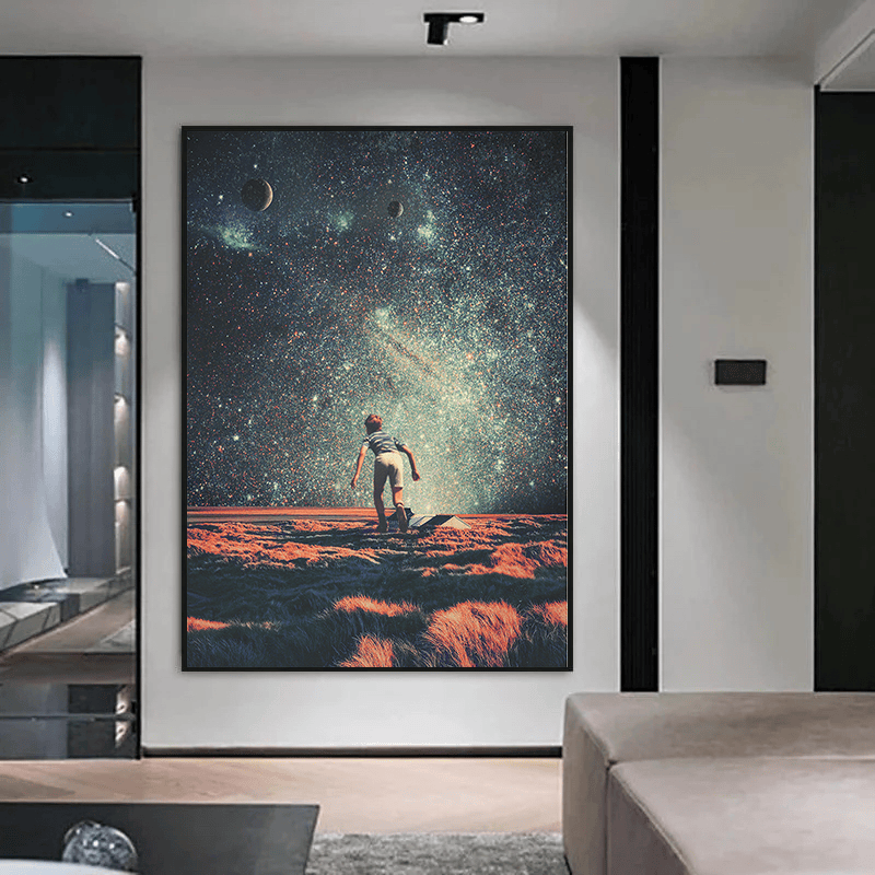 Minimalist black frame with starry galaxy painting on a white wall above a sofa wall art