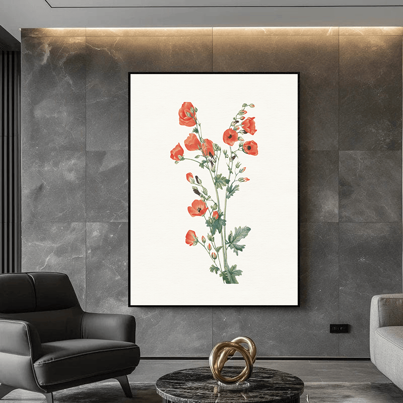 Orange botanical blooms wall art, red flowers and green stems print in a black frame above a dark modern chair