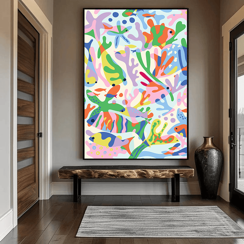 Abstract underwater coral and fish wall art in a black frame hanging in an entryway above a rustic wooden bench