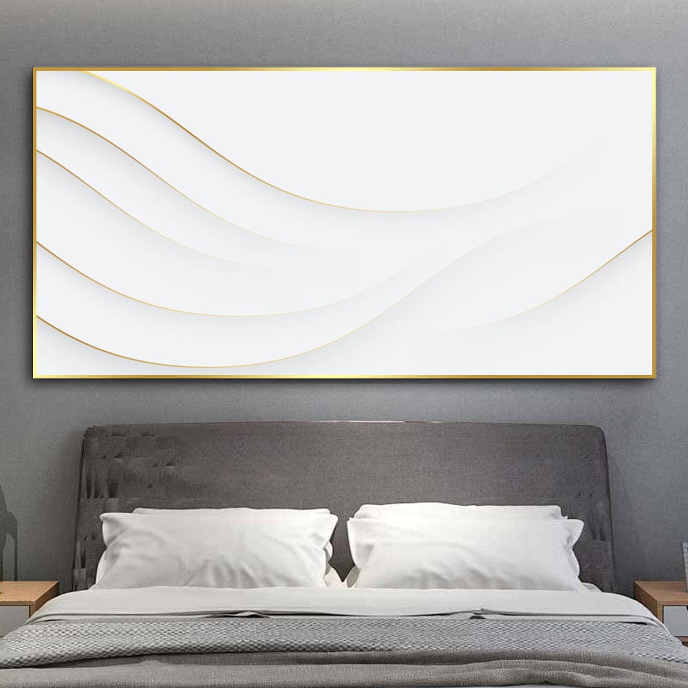 Minimalist white wave wall art with gold edges, hanging above a bed with gray pillows