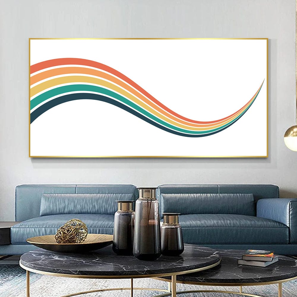 Abstract landscape painting with retro rainbow waves wall art in a gold frame above a blue sofa