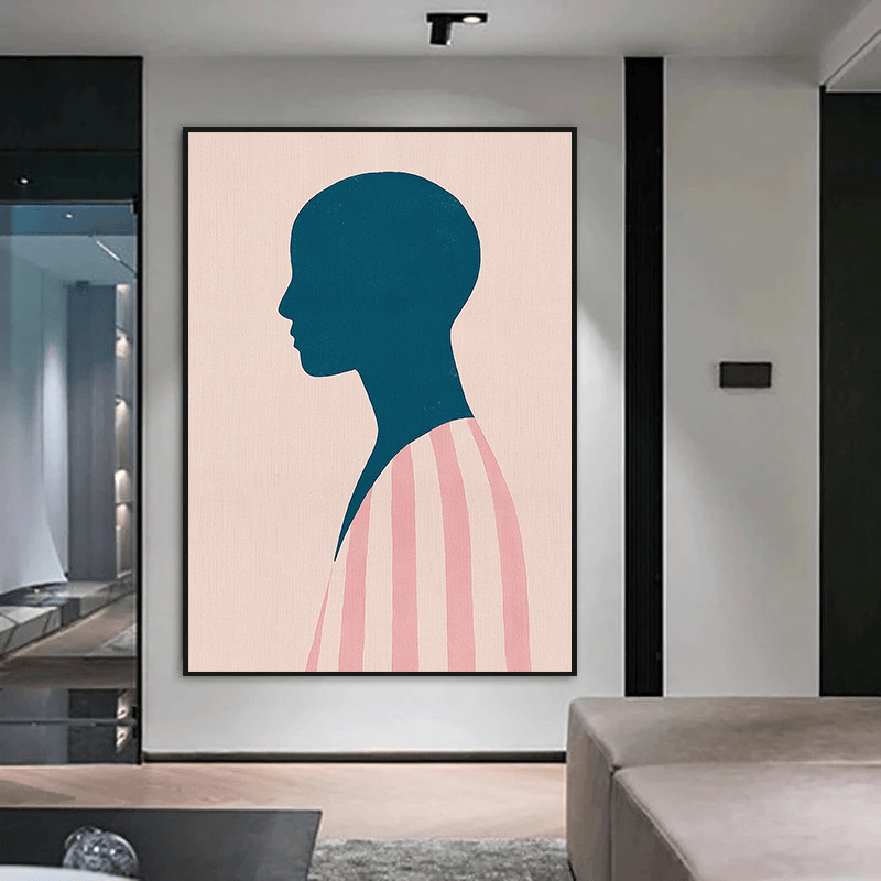 Minimalist woman profile portrait wall art, dark teal silhouette on a blush pink background with striped garment