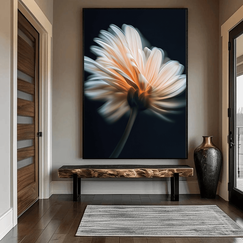 Soft glowing flower botanical wall art, ivory and peach petal composition in a black frame hanging in an entryway