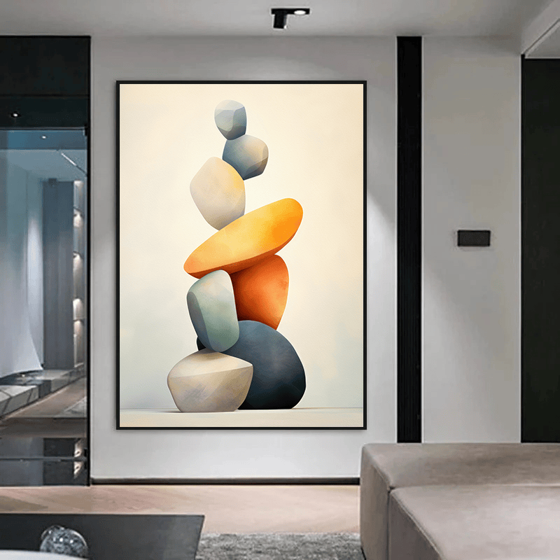 Abstract balancing rocks wall art, sculptural arrangement of smooth stones in blue, grey, and orange in a thin black frame