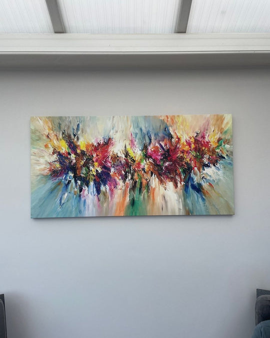Wonder Love canvas, a colourful abstract, on a pale conservatory wall